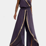 Elegante Donatila Mono con Detalles Dorados y Pierna Abierta para un Estilo Deslumbrante