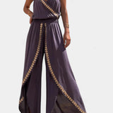 Elegante Donatila Mono con Detalles Dorados y Pierna Abierta para un Estilo Deslumbrante