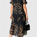 Elegante Vestido Caftán Jillian Negro con Estampado Abstracto en Oro y Diseño en Escote en V