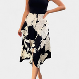 Elegante vestido Raquel con top de punto y falda floral con abertura para un estilo sofisticado