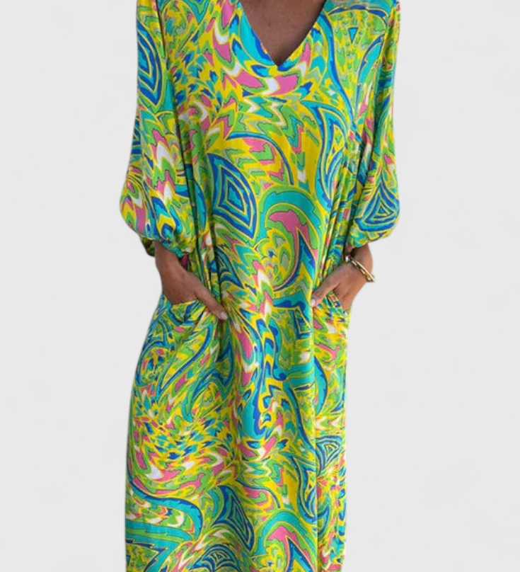 Elegante vestido maxi bohemio Carmina con escote en V y estampado abstracto