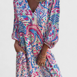 Elegante vestido maxi bohemio Carmina con escote en V y estampado abstracto