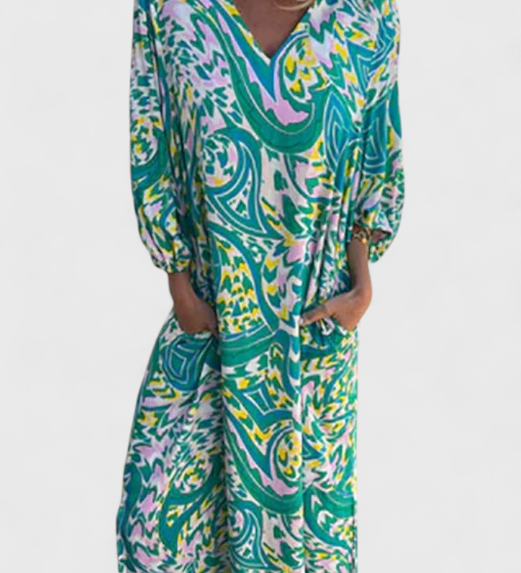 Elegante vestido maxi bohemio Carmina con escote en V y estampado abstracto