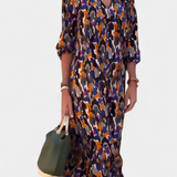 Teodora Vestido Retro con Elegante Escote en V y Encantadoras Mangas Abullonadas