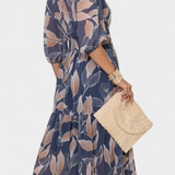 Elegante vestido largo floral Aísha con corte fluido y hermoso estampado de hojas