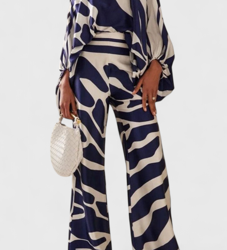 Set de Dos Piezas con Hombros a Descubrir y Pantalones Amplios con Estampado Elegante