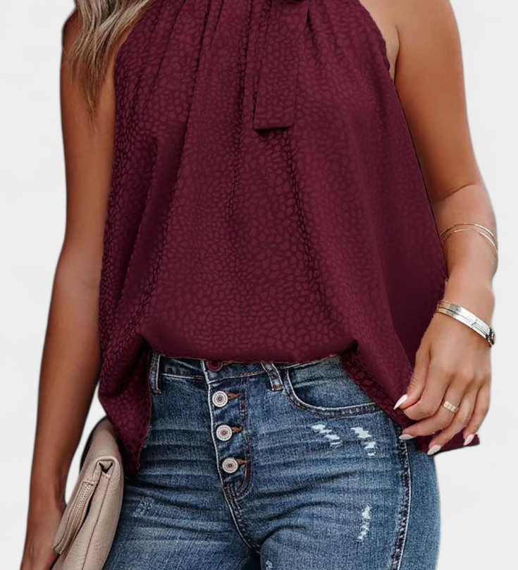 Elegante Adela Top sin mangas con estampado de leopardo, cuello alto y lazo para un estilo atrevido y sofisticado