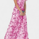Elegante vestido maxi floral con escote en V y mangas aladas para un look sofisticado