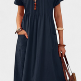 Vestido Lottie de longitud media con bolsillos para un estilo elegante y cómodo