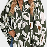 Filomena Blusa Elegante con Media Botonadura y Manga Abullonada en Estampado Floral Abstracto