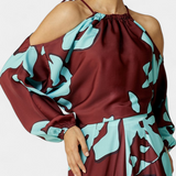Elegante Monte Vestido Largo con Detalles en Mangas y Estampado Abstracto para una Mirada Sofisticada