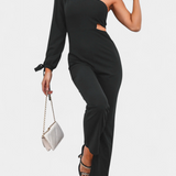 Elegante vestido mono asimétrico Sahar con corte en el bícleo, manga larga y detalle anudado