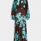 Elegante Monte Vestido Largo con Detalles en Mangas y Estampado Abstracto para una Mirada Sofisticada