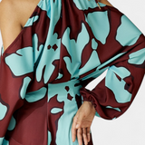 Elegante Monte Vestido Largo con Detalles en Mangas y Estampado Abstracto para una Mirada Sofisticada