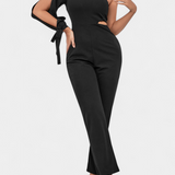 Elegante vestido mono asimétrico Sahar con corte en el bícleo, manga larga y detalle anudado