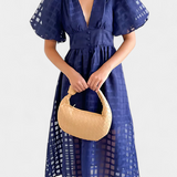 Vestido midi de manga abullonada con patrón de cuadros y detalle de caléndula