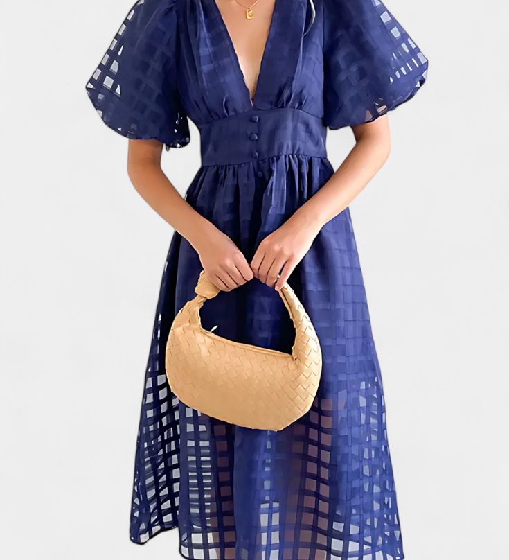 Vestido midi de manga abullonada con patrón de cuadros y detalle de caléndula